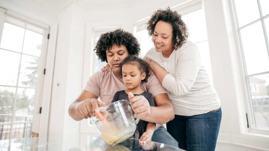 Parents baking with child